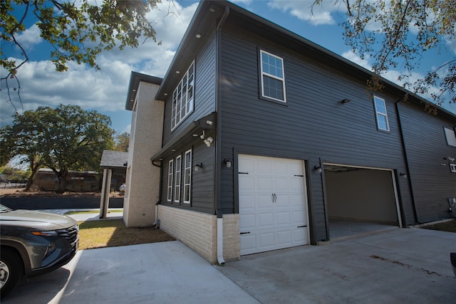 view of side of property with a garage