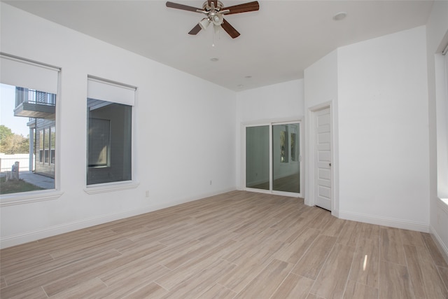 spare room with light hardwood / wood-style floors and ceiling fan