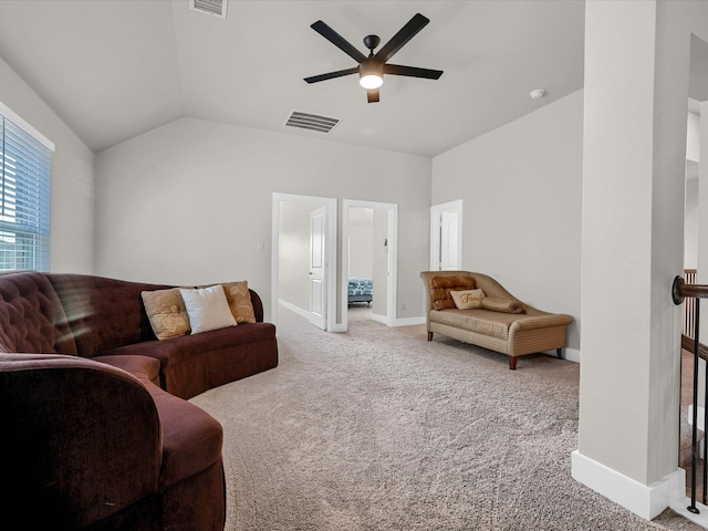 living room featuring ceiling fan, vaulted ceiling, and carpet