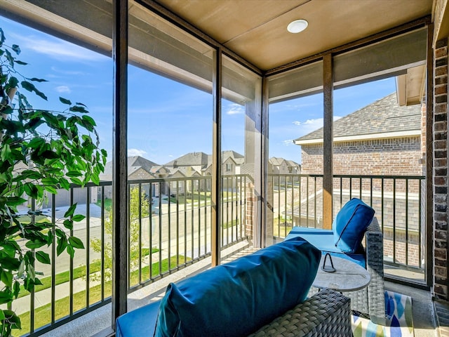 sunroom with a residential view