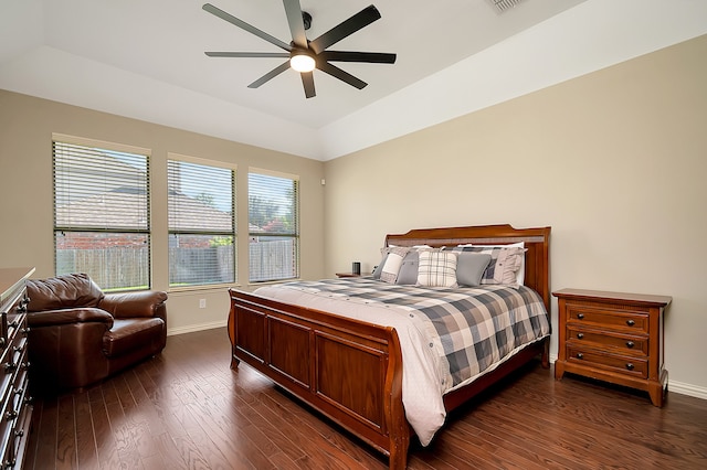 bedroom with ceiling fan and dark hardwood / wood-style flooring