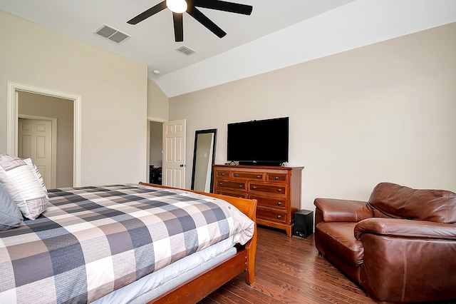 bedroom with dark wood-type flooring, vaulted ceiling, and ceiling fan