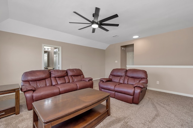 carpeted living room featuring vaulted ceiling and ceiling fan