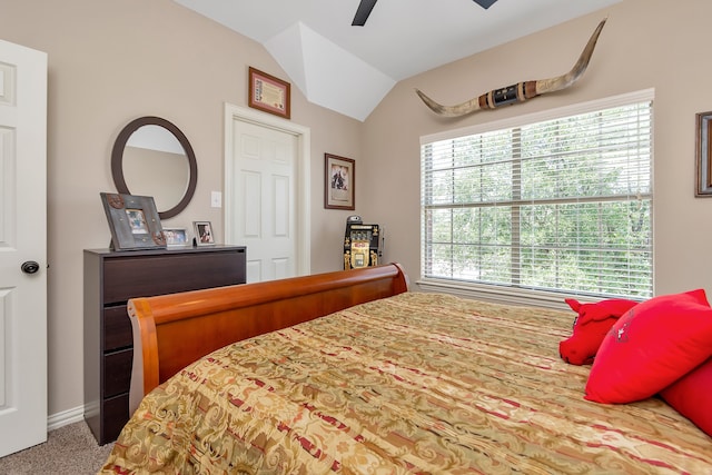 bedroom featuring carpet, vaulted ceiling, and ceiling fan