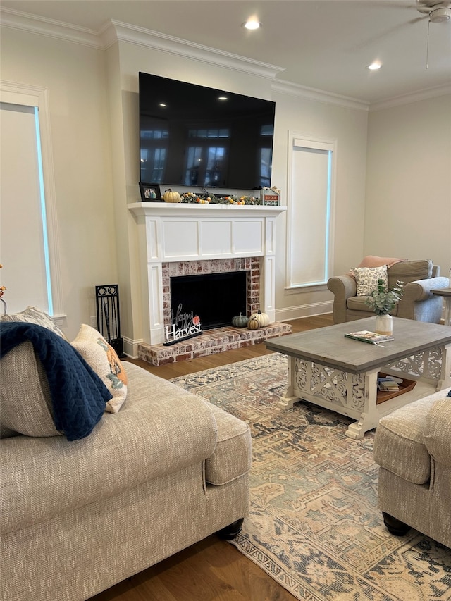 2108 Pecan Square Ave, Shreveport, LA 71106 - living area with wood finished floors, ornamental molding, a ceiling fan, a brick fireplace, and recessed lighting