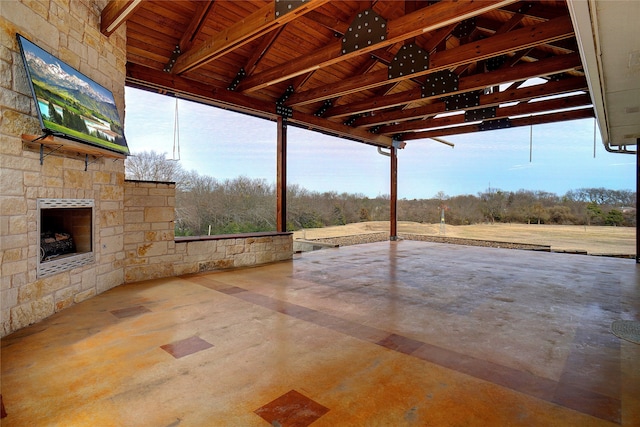 view of patio / terrace featuring an outdoor stone fireplace