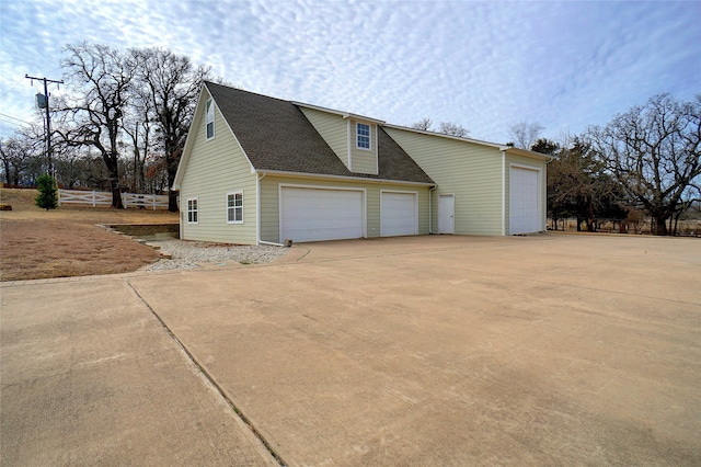 view of side of home with a garage