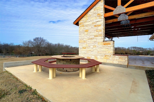 view of patio featuring an outdoor fire pit