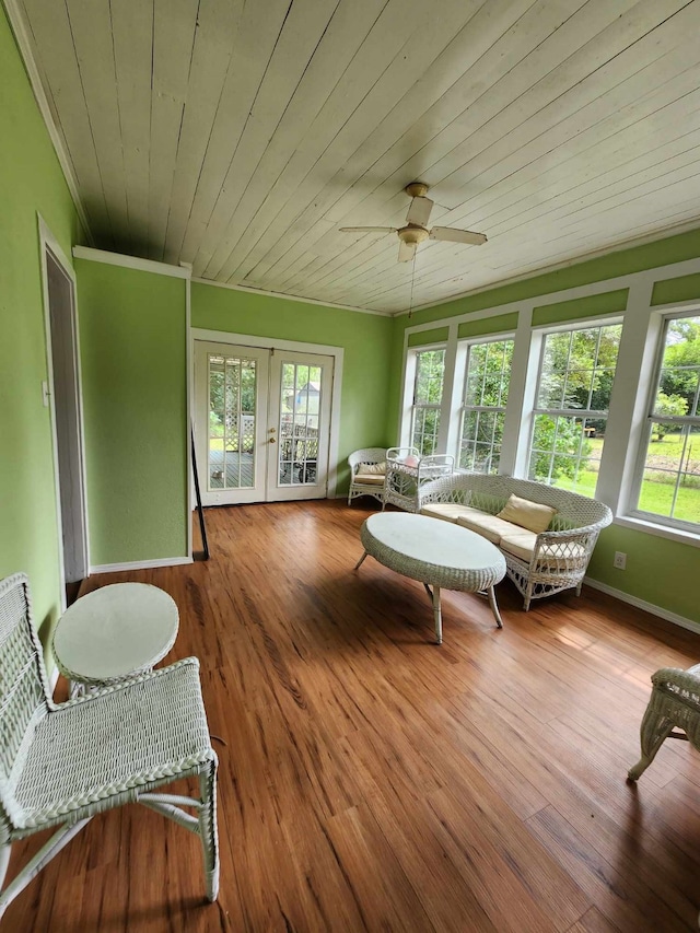 sunroom / solarium with french doors, ceiling fan, and wooden ceiling