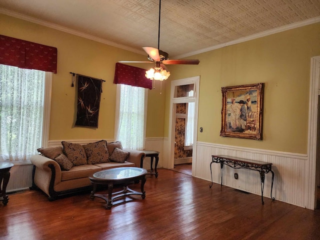 living room with ceiling fan, hardwood / wood-style flooring, and ornamental molding