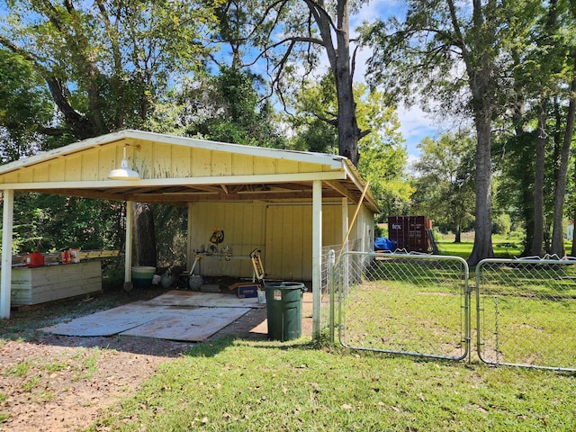 view of outbuilding featuring a lawn