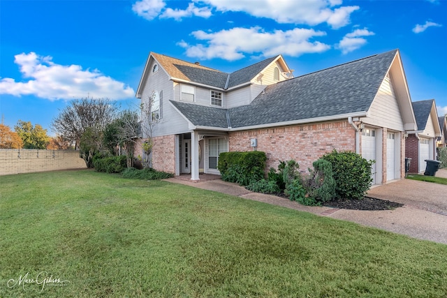 view of front of property featuring a front yard and a garage