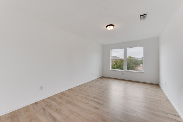 unfurnished room featuring light hardwood / wood-style floors