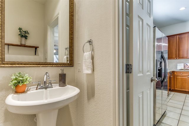 bathroom featuring sink and tile patterned flooring