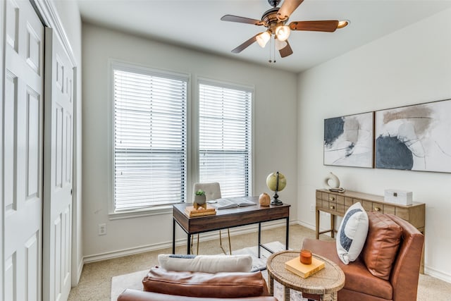 carpeted office with ceiling fan