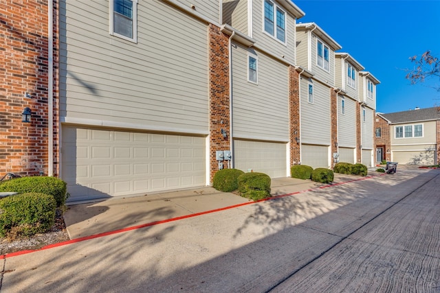 view of side of property with a garage