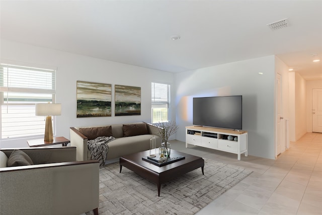 living room featuring light tile patterned flooring