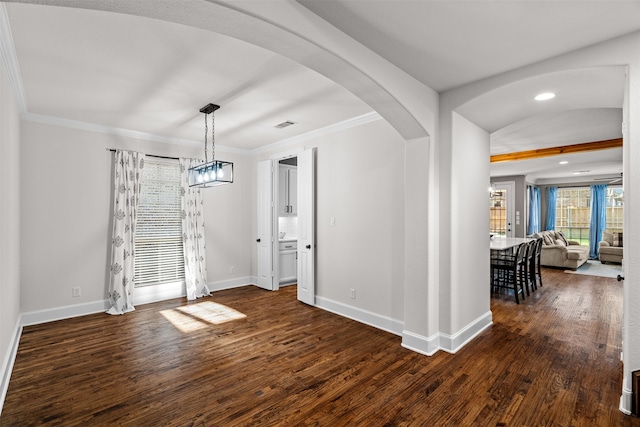 unfurnished dining area featuring dark hardwood / wood-style floors and crown molding