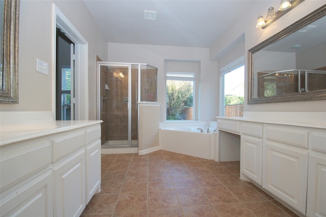 bathroom featuring vanity, plus walk in shower, and tile patterned floors