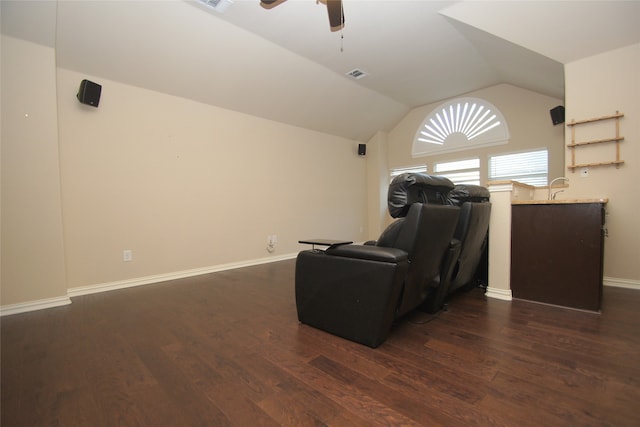 interior space featuring dark wood-type flooring, ceiling fan, and vaulted ceiling