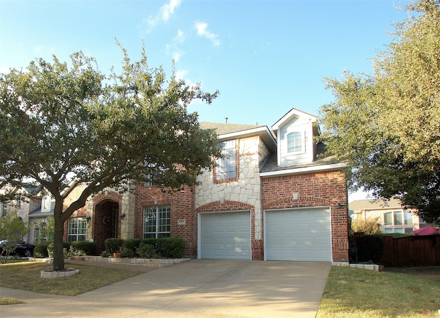 view of front of home with a front lawn and a garage