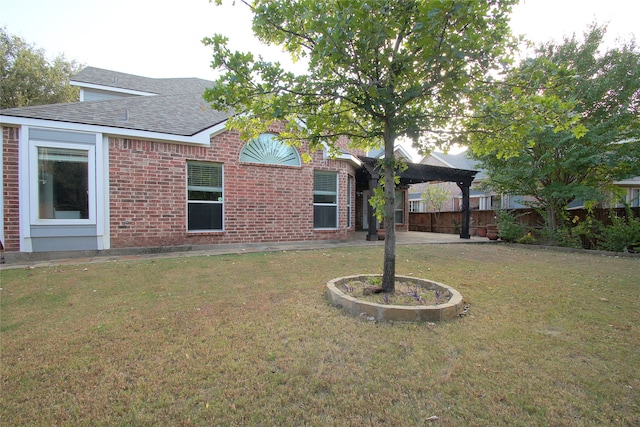 exterior space featuring a yard and a patio area