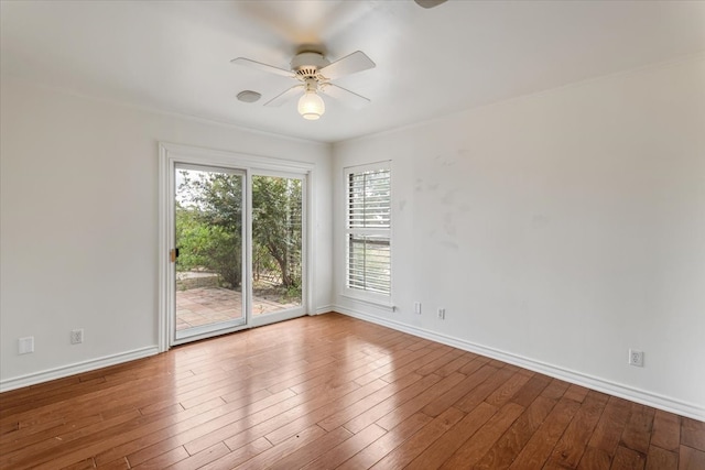 empty room featuring light wood-type flooring and ceiling fan