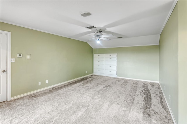 unfurnished bedroom with ornamental molding, light colored carpet, and ceiling fan