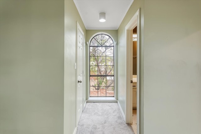 doorway to outside with light carpet and crown molding