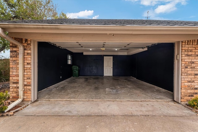 garage featuring a carport