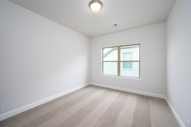 unfurnished room featuring carpet flooring