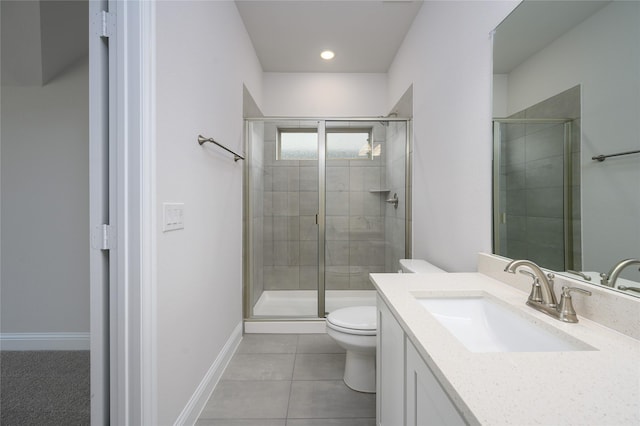 bathroom featuring an enclosed shower, vanity, toilet, and tile patterned floors