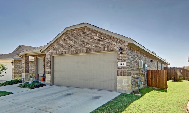 view of front of house with a garage and a front lawn