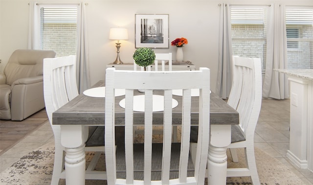 tiled dining area with a healthy amount of sunlight