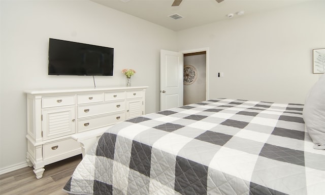 bedroom featuring light hardwood / wood-style flooring and ceiling fan