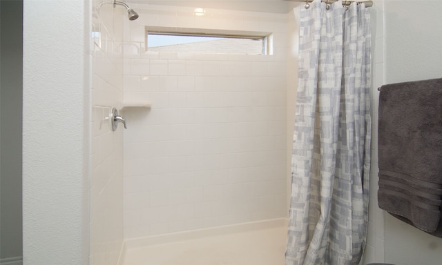 bathroom featuring a shower with curtain