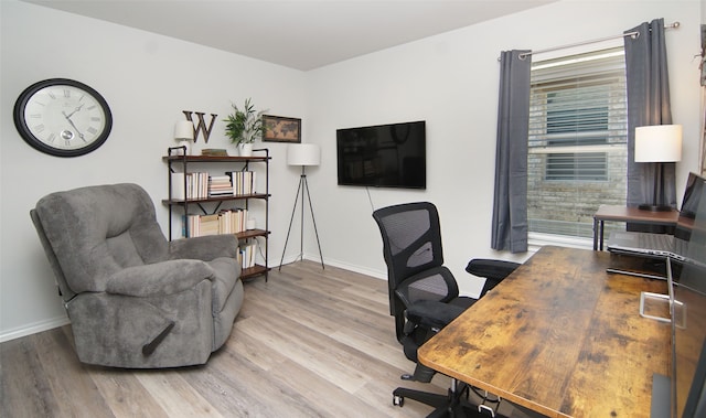 office area with light hardwood / wood-style flooring