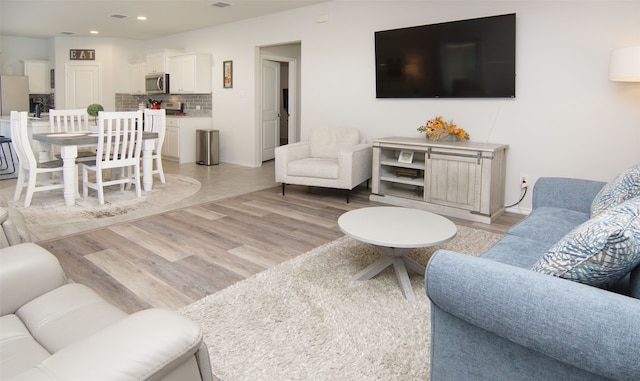 living room with light hardwood / wood-style floors