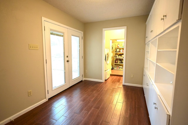 doorway with dark hardwood / wood-style flooring, french doors, and a textured ceiling