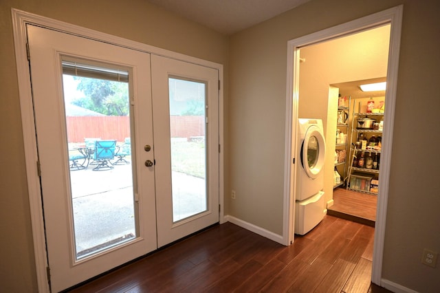 doorway featuring dark wood-type flooring, washer / clothes dryer, and french doors