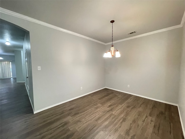 unfurnished room with ornamental molding, a notable chandelier, and dark hardwood / wood-style floors