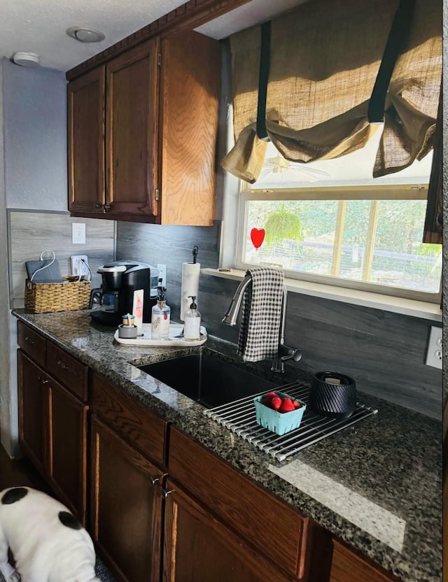 kitchen featuring dark stone counters