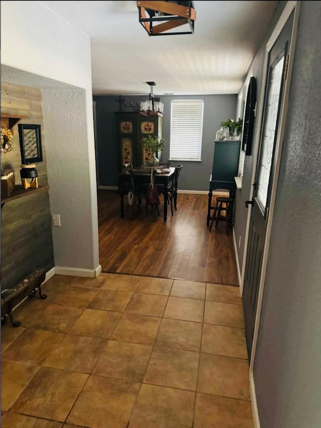 corridor featuring dark tile patterned flooring