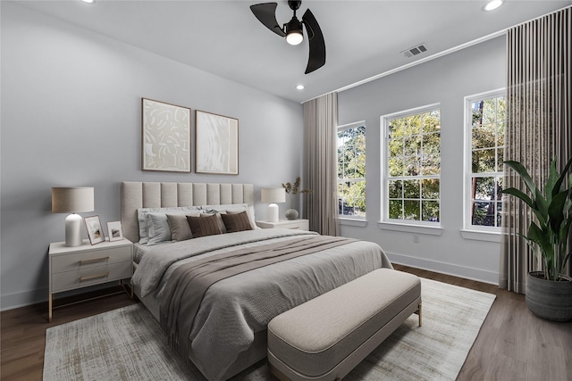 bedroom with wood-type flooring and ceiling fan