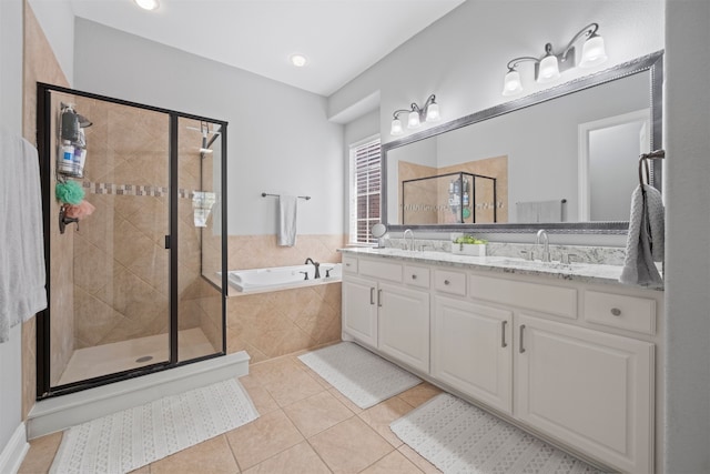 bathroom featuring vanity, tile patterned floors, and separate shower and tub