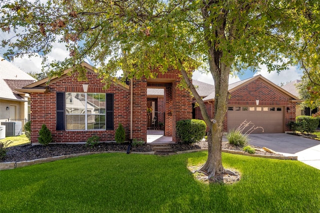 view of front of house with cooling unit, a front lawn, and a garage