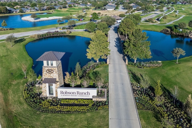 birds eye view of property with a water view