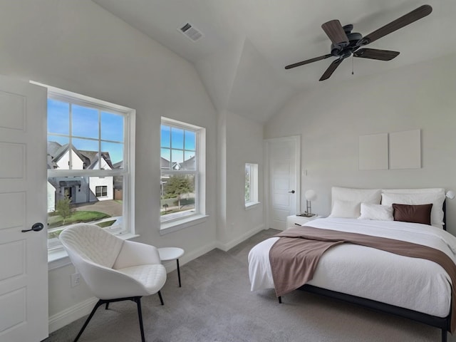 bedroom with ceiling fan, light colored carpet, and vaulted ceiling