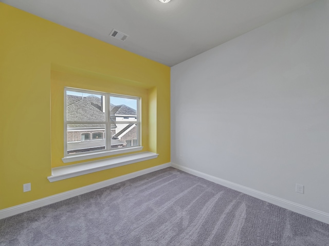 unfurnished room featuring carpet floors