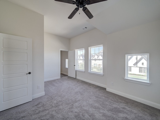 unfurnished bedroom featuring ceiling fan, carpet floors, and lofted ceiling